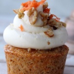 carrot cake cupcake, white wood background